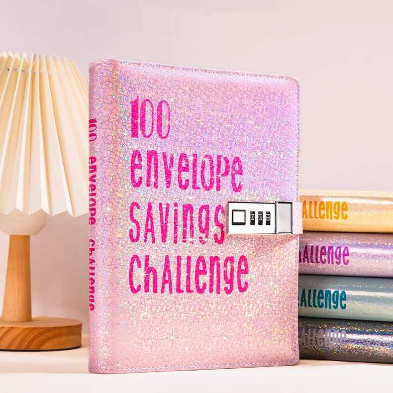 Pink glittery book titled '100 Envelope Savings Challenge' on a light background